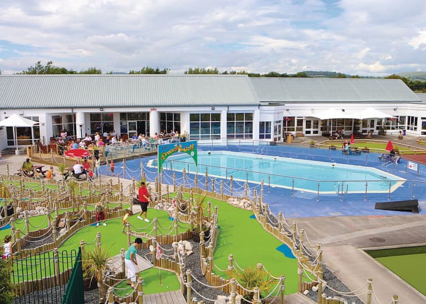 Mini golf and outdoor swimming pool at an accessible holiday park in the Lake District