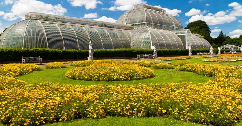Greenhouse and flower beds in Kew Gardens, London