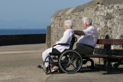 Elderly people looking out to sea