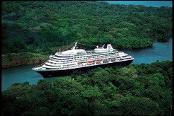 Cruise ship on a river in lush surroundings